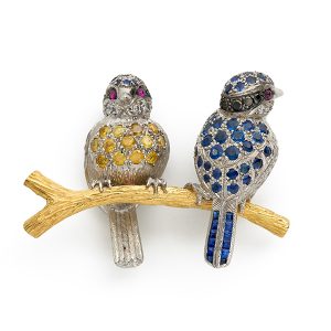 Bluetits on a branch with blue and yellow- sapphires