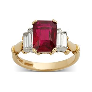 Emerald-cut ruby with stepped baguette diamonds