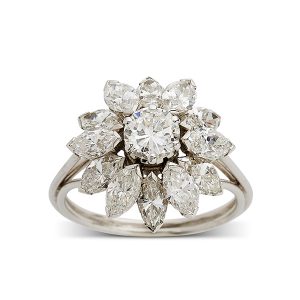 Oval central diamond with marquise cluster surround