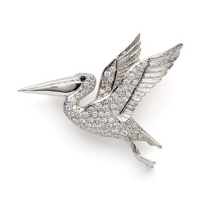 Pelican in flight with diamonds