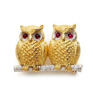Two owls on branch with diamonds