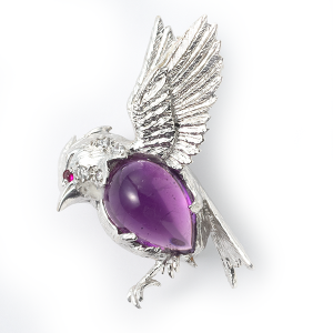 Flying bird with amethyst